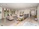 Elegant living room boasts a stone fireplace, plush seating, and bright natural light at 3020 Poplar Hill Rd, Charlotte, NC 28270