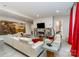 Bright living room features a cozy fireplace, tile accents, and comfortable seating at 3020 Poplar Hill Rd, Charlotte, NC 28270