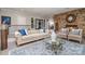 Elegant living room boasts a stone fireplace, plush seating, and bright natural light at 3020 Poplar Hill Rd, Charlotte, NC 28270
