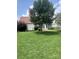 Large backyard with green grass and partial home view at 4817 Mossy Cup Ln, Monroe, NC 28110