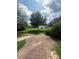 Landscaped backyard with stone path and storage shed at 4817 Mossy Cup Ln, Monroe, NC 28110
