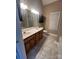 Bathroom with double vanity, tiled floor and a separate tub at 4817 Mossy Cup Ln, Monroe, NC 28110