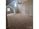 Large bedroom with vaulted ceiling and carpet at 4817 Mossy Cup Ln, Monroe, NC 28110