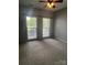 Spacious bedroom with carpet and large windows at 4817 Mossy Cup Ln, Monroe, NC 28110