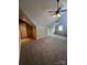 Spacious bonus room with carpet, door, and window at 4817 Mossy Cup Ln, Monroe, NC 28110