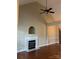Living room features a marble fireplace and hardwood floors at 4817 Mossy Cup Ln, Monroe, NC 28110