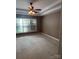 Spacious main bedroom with carpeted floors and ceiling fan at 4817 Mossy Cup Ln, Monroe, NC 28110