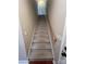 Carpeted staircase with wooden handrail at 4817 Mossy Cup Ln, Monroe, NC 28110