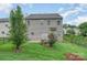 Two story house with fenced backyard, patio, and landscaping at 4819 Abercromby St, Charlotte, NC 28213