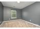 Simple bedroom with grey walls and carpet at 4819 Abercromby St, Charlotte, NC 28213