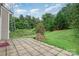 A backyard patio with brick pavers and landscaping at 4819 Abercromby St, Charlotte, NC 28213