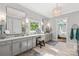 Bright bathroom featuring double sinks, vanity, and a large window bringing in natural light at 127 Tradition Ln, Mooresville, NC 28115