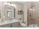 Modern bathroom with glass enclosed shower, vanity with decorative mirror, and stylish fixtures at 127 Tradition Ln, Mooresville, NC 28115