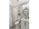 Updated bathroom with a shower-tub combo, decorative mirror, and modern fixtures at 127 Tradition Ln, Mooresville, NC 28115