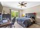 This bedroom features a ceiling fan, window, desk, and full-sized bed at 127 Tradition Ln, Mooresville, NC 28115