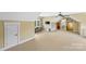Spacious bonus room with carpet, television, and access to additional rooms at 127 Tradition Ln, Mooresville, NC 28115