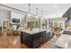 Open concept kitchen featuring a large island, stainless steel appliances, and hardwood floors at 127 Tradition Ln, Mooresville, NC 28115