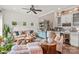 Comfortable living room with ample seating, a side bar, hardwood floors and stylish decor at 127 Tradition Ln, Mooresville, NC 28115