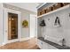 Well-organized mud room area with built-in bench seating, storage, and easy access to a pantry at 127 Tradition Ln, Mooresville, NC 28115