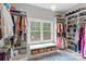 Spacious walk-in closet with ample storage, shelving, and a window providing natural light at 127 Tradition Ln, Mooresville, NC 28115