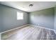 Bright bedroom with wood-look flooring, natural light, and neutral walls at 131 Sam Smith Rd, Kings Mountain, NC 28086