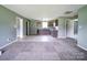 Spacious living room flowing into a kitchen with cabinets and countertops at 131 Sam Smith Rd, Kings Mountain, NC 28086