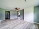 Spacious living room with gray walls and a brick accent wall at 131 Sam Smith Rd, Kings Mountain, NC 28086