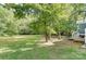 Spacious backyard with firepit and trees at 5601 Indian Brook Dr, Matthews, NC 28104