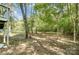 Wooded backyard with firepit at 5601 Indian Brook Dr, Matthews, NC 28104