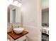 Modern bathroom with vessel sink and wood vanity top at 5601 Indian Brook Dr, Matthews, NC 28104