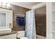 Clean bathroom with dark tile and a modern vanity at 5601 Indian Brook Dr, Matthews, NC 28104