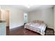 Spacious bedroom with hardwood floors and access to closet at 5601 Indian Brook Dr, Matthews, NC 28104