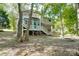 Two story house with deck and firepit at 5601 Indian Brook Dr, Matthews, NC 28104