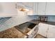 Kitchen detail showing granite countertops and gas cooktop at 5601 Indian Brook Dr, Matthews, NC 28104