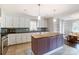 Modern kitchen with stainless steel appliances and an island at 5601 Indian Brook Dr, Matthews, NC 28104