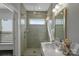 Modern bathroom featuring a shower with glass doors and sleek fixtures at 12119 Brooklyn Ave, Charlotte, NC 28204