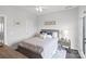 A comfortably furnished bedroom with a bed, nightstand, and stylish decor at 12119 Brooklyn Ave, Charlotte, NC 28204