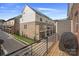Balcony view of townhome exterior with brick and siding at 12119 Brooklyn Ave, Charlotte, NC 28204