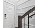 Hallway featuring a wooden handrail and white shiplap walls at 12119 Brooklyn Ave, Charlotte, NC 28204
