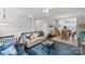 Open-concept living room boasts hardwood floors, neutral paint, and is open to the kitchen at 12119 Brooklyn Ave, Charlotte, NC 28204
