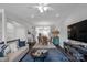 Open-concept floorplan with living and dining areas features hardwood floors and neutral paint at 12119 Brooklyn Ave, Charlotte, NC 28204