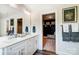 Double vanity bathroom with walk-in closet at 8611 Frank Grier Rd # 1, Charlotte, NC 28215