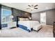 Main bedroom with blue upholstered bed and ensuite bath at 8611 Frank Grier Rd # 1, Charlotte, NC 28215
