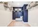 Walk-in closet with ample shelving and bench at 8611 Frank Grier Rd # 1, Charlotte, NC 28215