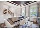 Dining room with a dark wood table, chandelier, and view to the entry at 8611 Frank Grier Rd # 1, Charlotte, NC 28215
