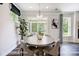 Bright dining room features a dark wood table with seating for six and an attractive chandelier at 8611 Frank Grier Rd # 1, Charlotte, NC 28215