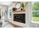 Modern fireplace with a shiplap wall and a large mirror at 8611 Frank Grier Rd # 1, Charlotte, NC 28215