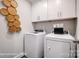Laundry room with washer, dryer, and overhead cabinets at 8611 Frank Grier Rd # 1, Charlotte, NC 28215