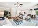 Open concept living room with kitchen view, hardwood floors and comfy seating at 8611 Frank Grier Rd # 1, Charlotte, NC 28215