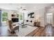 Spacious living room with fireplace, large windows, and hardwood floors at 8611 Frank Grier Rd # 1, Charlotte, NC 28215